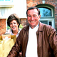 A 1993 photo of alleged "sex for security" scam artist Helen Crandall. Police suspect the groceries she is holding were paid for by her victim, husband David Crandall (right).